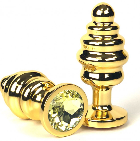 Золотистая ребристая анальная пробка с желтым кристаллом - 7 см. Золотистая ребристая анальная пробка с желтым кристаллом - 7 см.